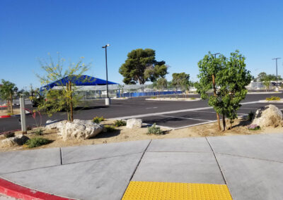 ullom elementary school parking lot with newly added trees and decorative rock in las vegas