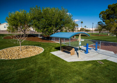 covered sitting area with new landscaping and fresh grass installed at woofter family park in las vegas