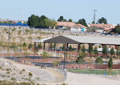 people walking along path from far away at lone mountain park in las vegas nevada