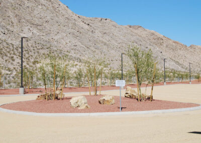 landscaping with trees and decorative rock for roundabout at Lone Mountain Equestrian Park nevada